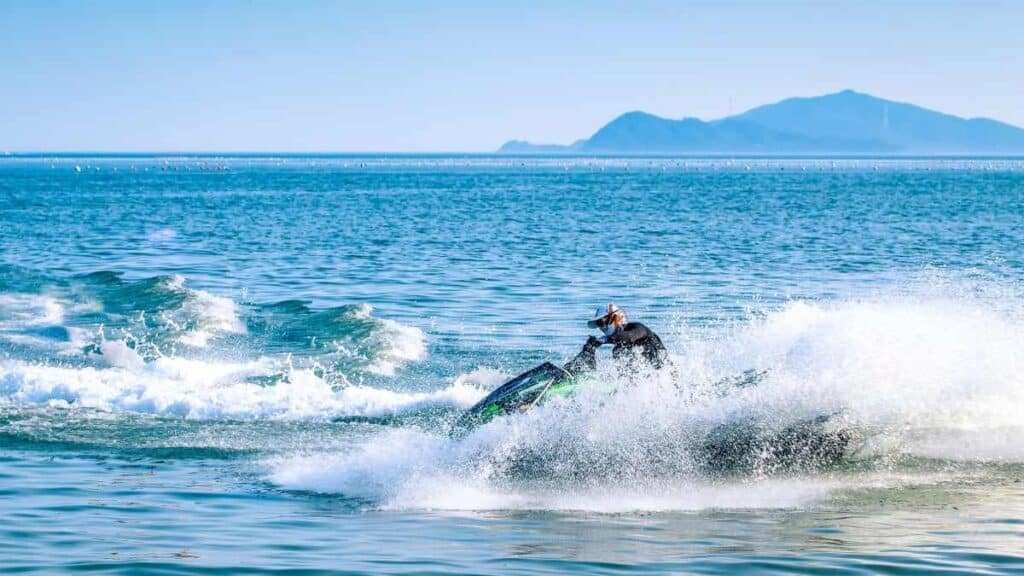 Men jet skiing in the Gulf Shores