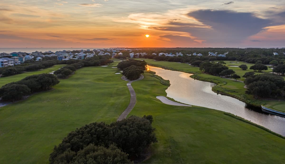 Aerial view of Kiva Dunes at sunset in Gulf Shores where you can go golfing